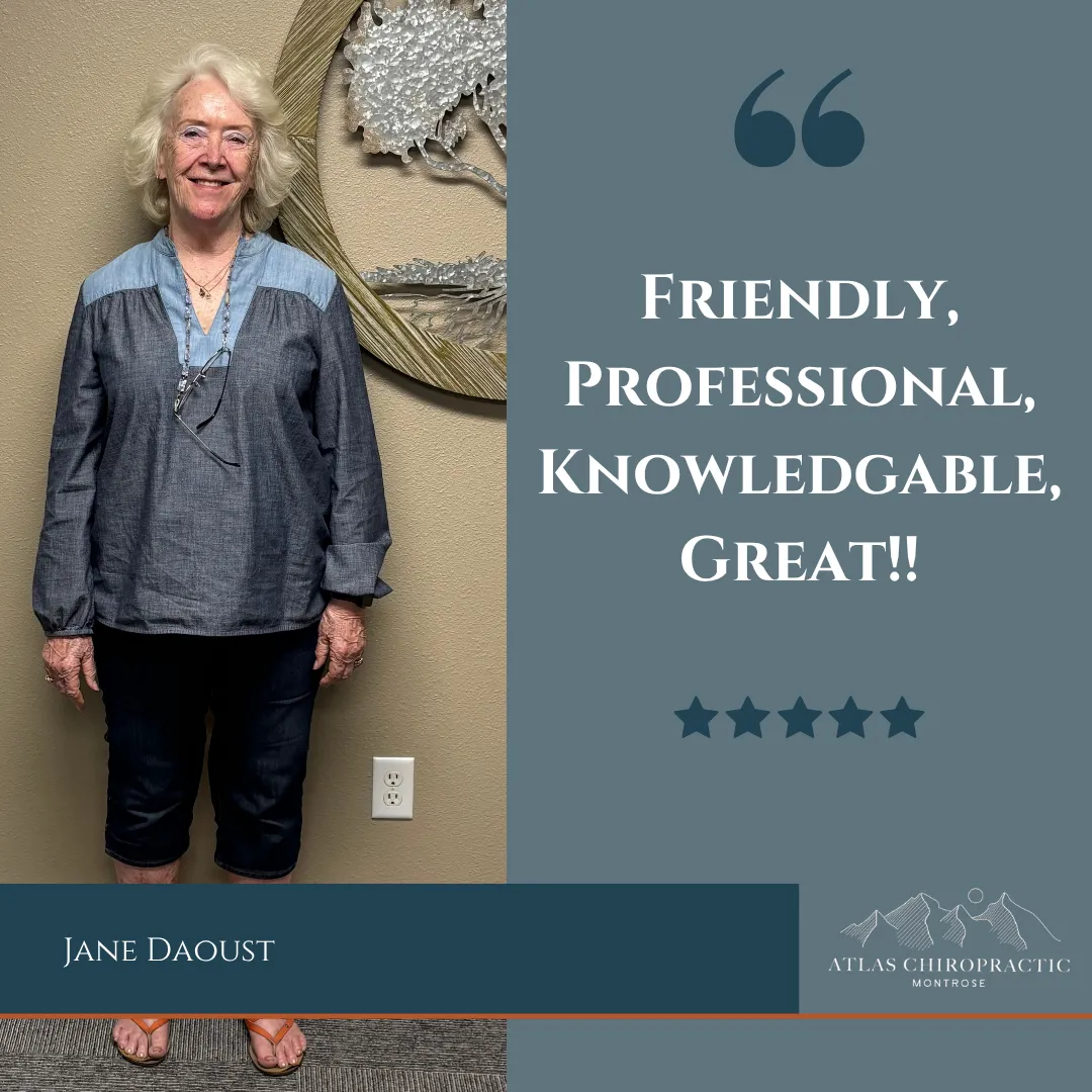 Chiropractic Montrose CO Jane Daoust Testimonial Jane Daoust standing against a wall smiling with a testimonial.